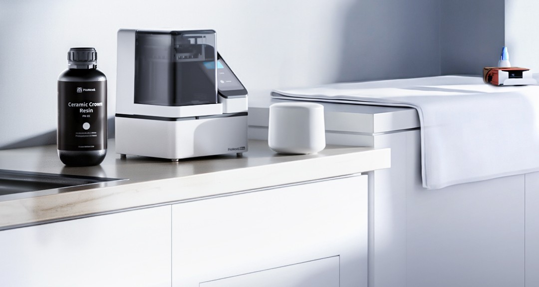PioNext Mini sitting compactly on a clinic counter beside dental supplies