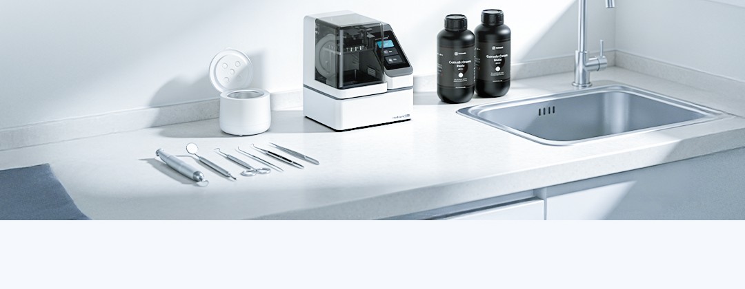 Wash Mini cleaning unit alongside PioNext Mini printer and resin bottles